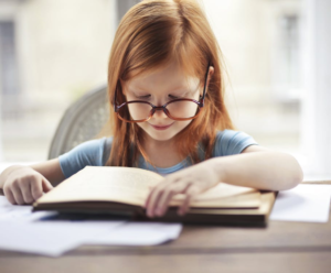 A kid wearing eyeglasses